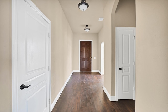 hallway with dark hardwood / wood-style floors