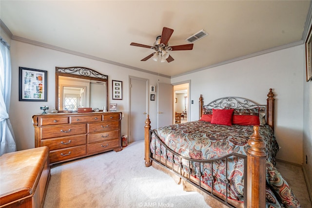 carpeted bedroom with ceiling fan and crown molding