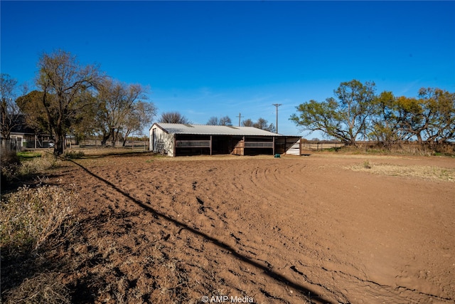 view of outbuilding with a rural view