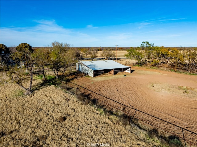 birds eye view of property with a rural view