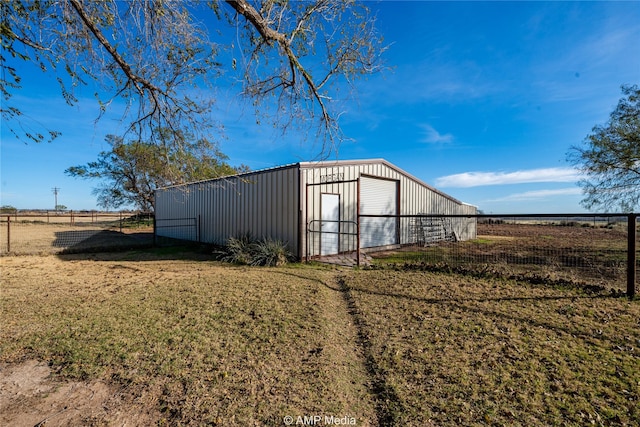 view of outbuilding with a yard