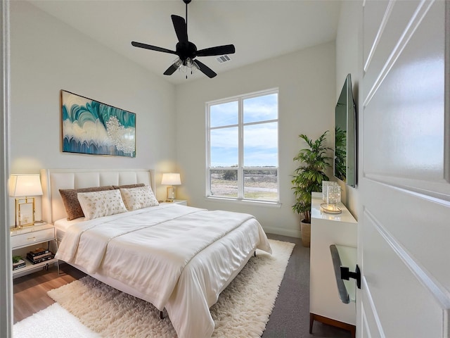 bedroom featuring hardwood / wood-style flooring and ceiling fan