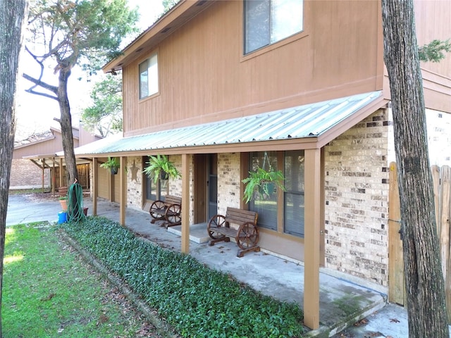 rear view of property featuring a patio