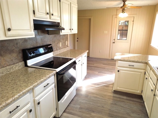 kitchen with a textured ceiling, dark hardwood / wood-style flooring, white range with electric cooktop, and ceiling fan