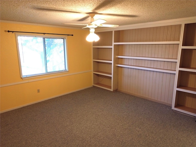 interior space featuring a textured ceiling, carpet floors, ceiling fan, and crown molding