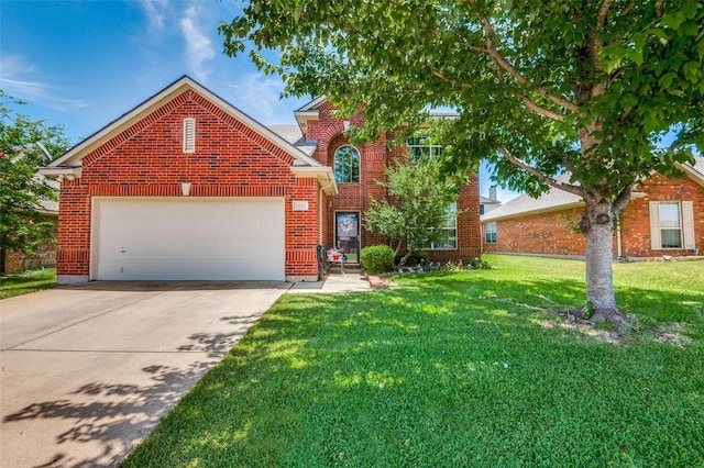 view of property featuring a front yard and a garage