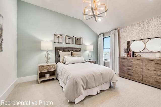 carpeted bedroom featuring a chandelier and vaulted ceiling