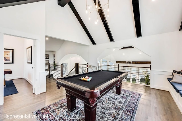 game room with beam ceiling, high vaulted ceiling, light wood-type flooring, and billiards