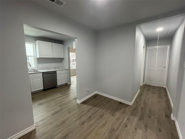 interior space featuring hardwood / wood-style flooring, a healthy amount of sunlight, and sink