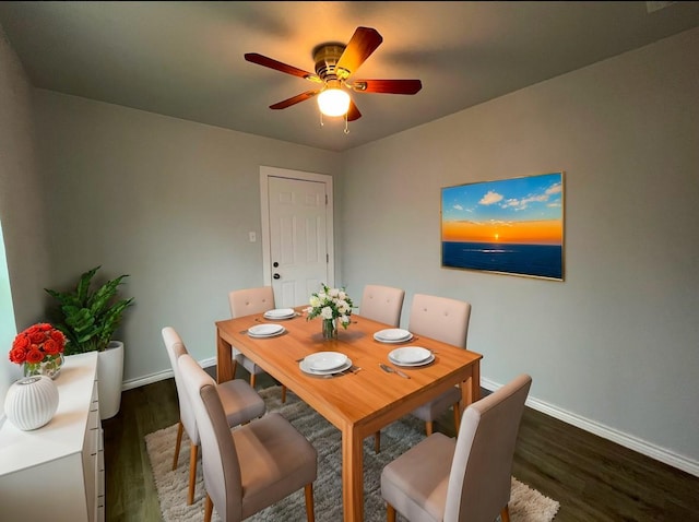 dining area featuring dark wood-type flooring and ceiling fan