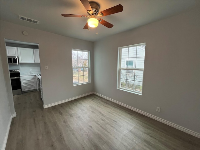 interior space featuring ceiling fan and hardwood / wood-style floors