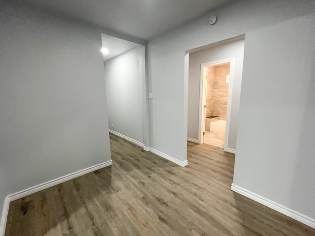 unfurnished room featuring wood-type flooring