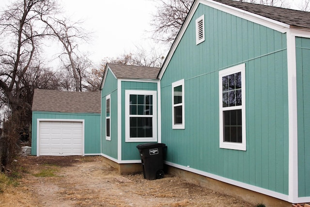 view of side of property with a garage