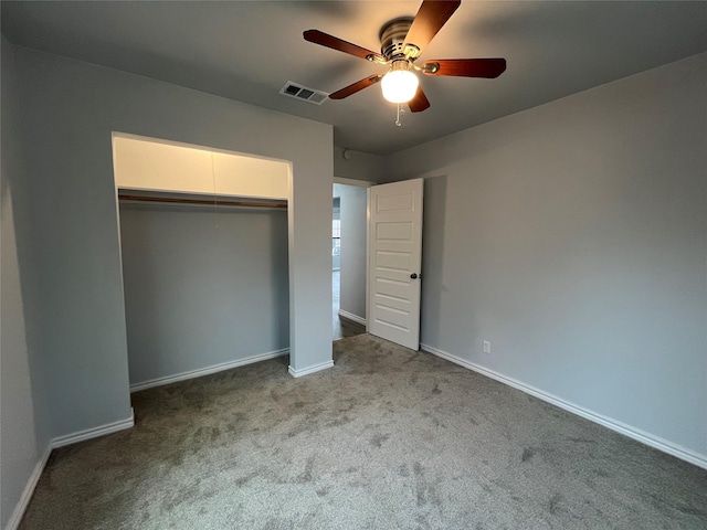 unfurnished bedroom with light colored carpet, ceiling fan, and a closet