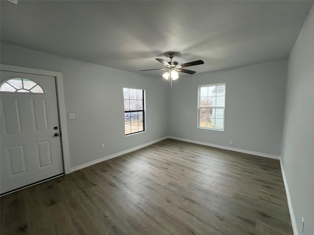 entrance foyer with dark hardwood / wood-style floors and ceiling fan