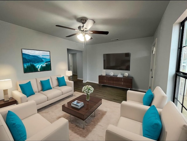 living room with ceiling fan and light wood-type flooring