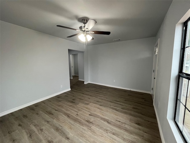 spare room with wood-type flooring and ceiling fan