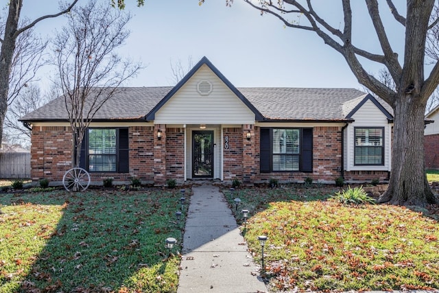 ranch-style home with a front yard