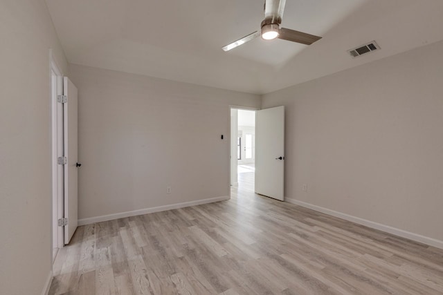 empty room with light hardwood / wood-style flooring and ceiling fan