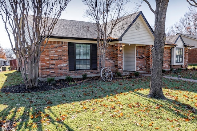 ranch-style home with a front lawn