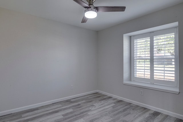 unfurnished room featuring ceiling fan and light wood-type flooring