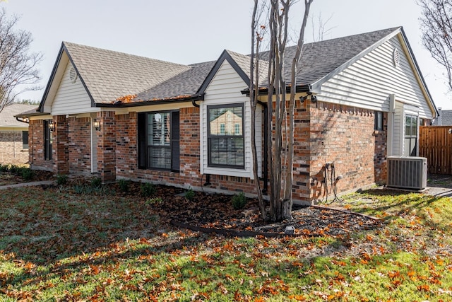 view of side of property with central AC