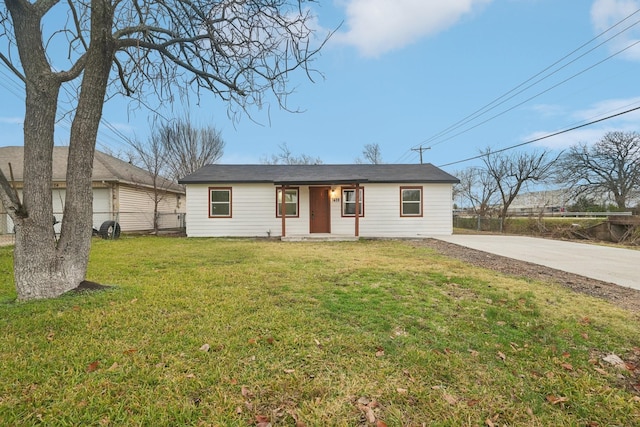 ranch-style house with a front lawn and a porch