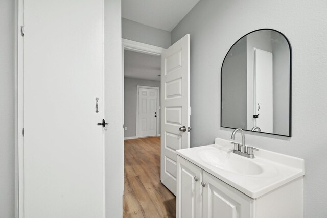 bathroom featuring vanity and hardwood / wood-style flooring