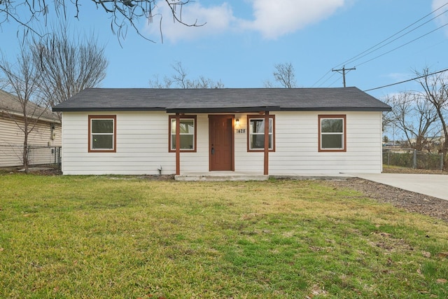 ranch-style house with covered porch and a front yard