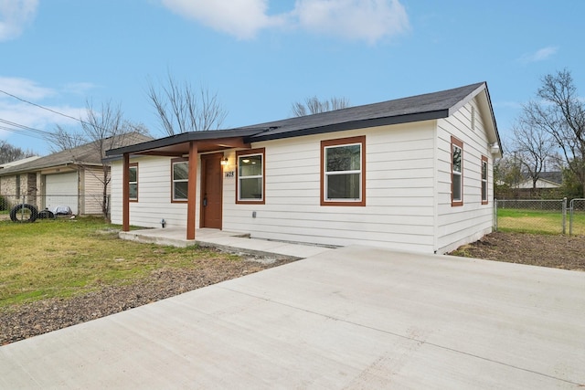 ranch-style house with a garage and a front yard