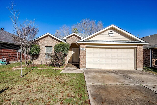 single story home featuring a front yard and a garage