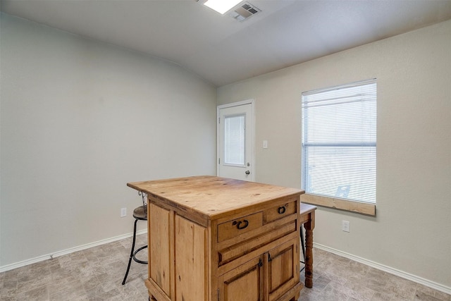 interior space featuring vaulted ceiling