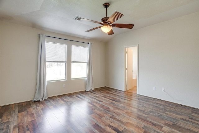 spare room featuring ceiling fan, wood-type flooring, and lofted ceiling