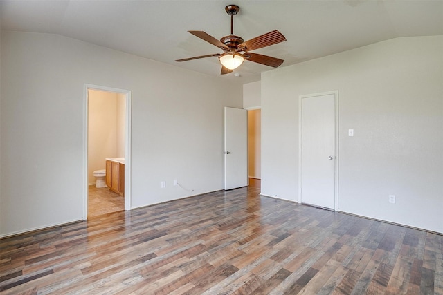 unfurnished bedroom featuring a closet, light hardwood / wood-style flooring, ensuite bath, and ceiling fan