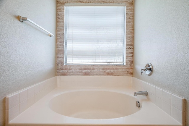 bathroom featuring a tub to relax in