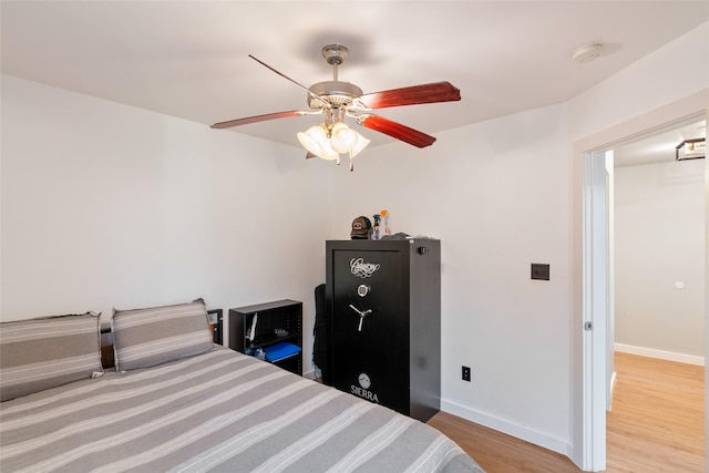 bedroom featuring light hardwood / wood-style flooring and ceiling fan