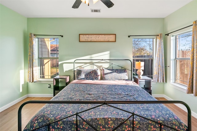 bedroom featuring hardwood / wood-style floors and ceiling fan