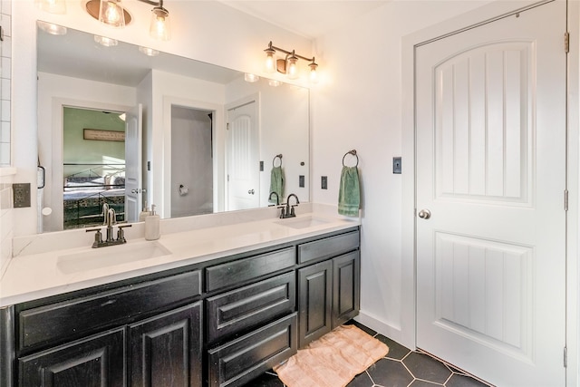 bathroom with tile patterned floors and vanity