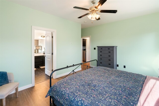 walk in closet with light hardwood / wood-style flooring