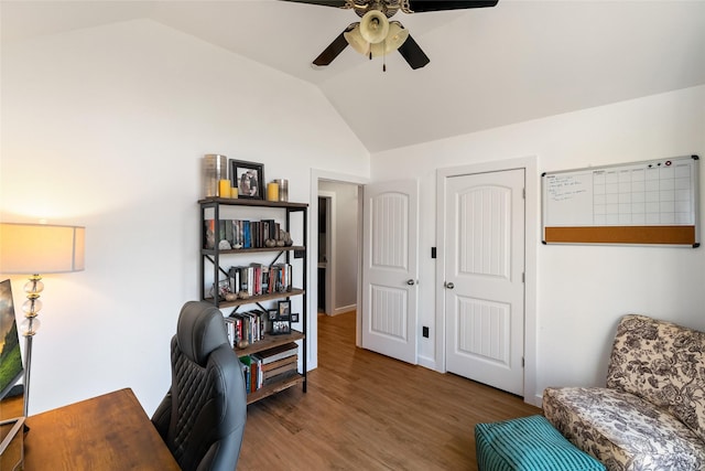 office with hardwood / wood-style flooring, ceiling fan, and vaulted ceiling