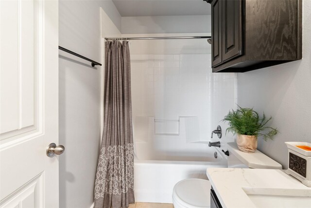 full bathroom featuring shower / bath combination with curtain, vanity, and toilet