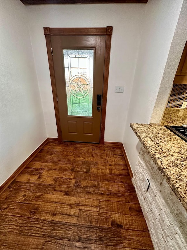 doorway with dark hardwood / wood-style floors