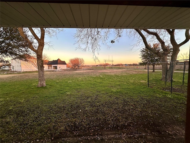 view of yard at dusk