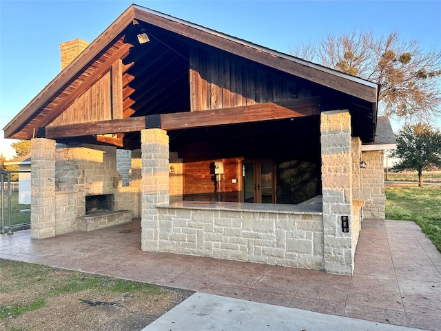 view of patio / terrace with an outdoor stone fireplace