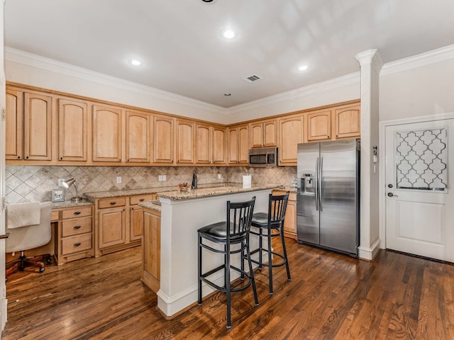 kitchen with dark hardwood / wood-style flooring, light stone counters, stainless steel appliances, crown molding, and a kitchen island