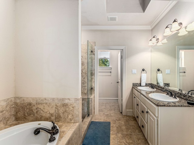 bathroom featuring plus walk in shower, vanity, and ornamental molding