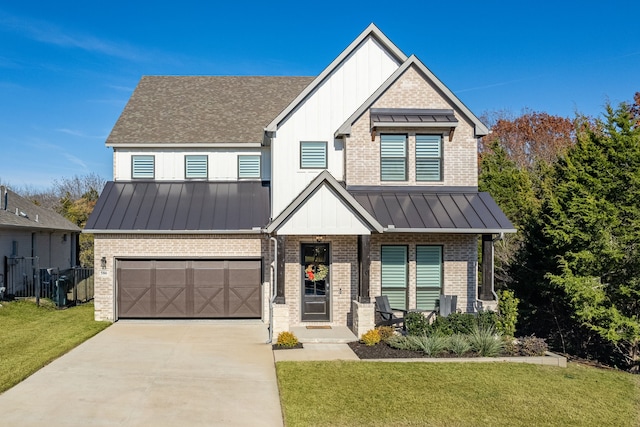 view of front of property with a front yard and a garage