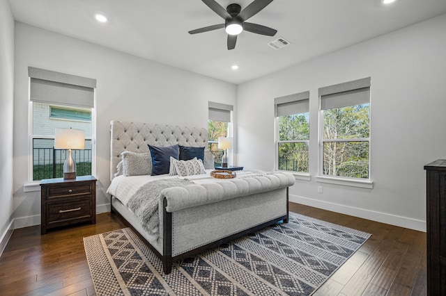 bedroom featuring dark hardwood / wood-style flooring and ceiling fan