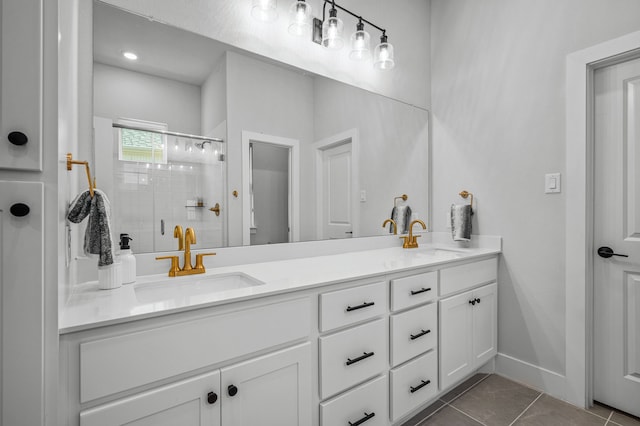 bathroom featuring tile patterned flooring, vanity, and an enclosed shower