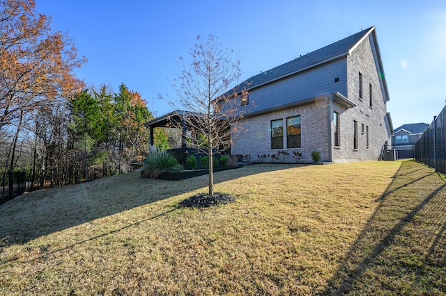 back of property with a yard and central air condition unit